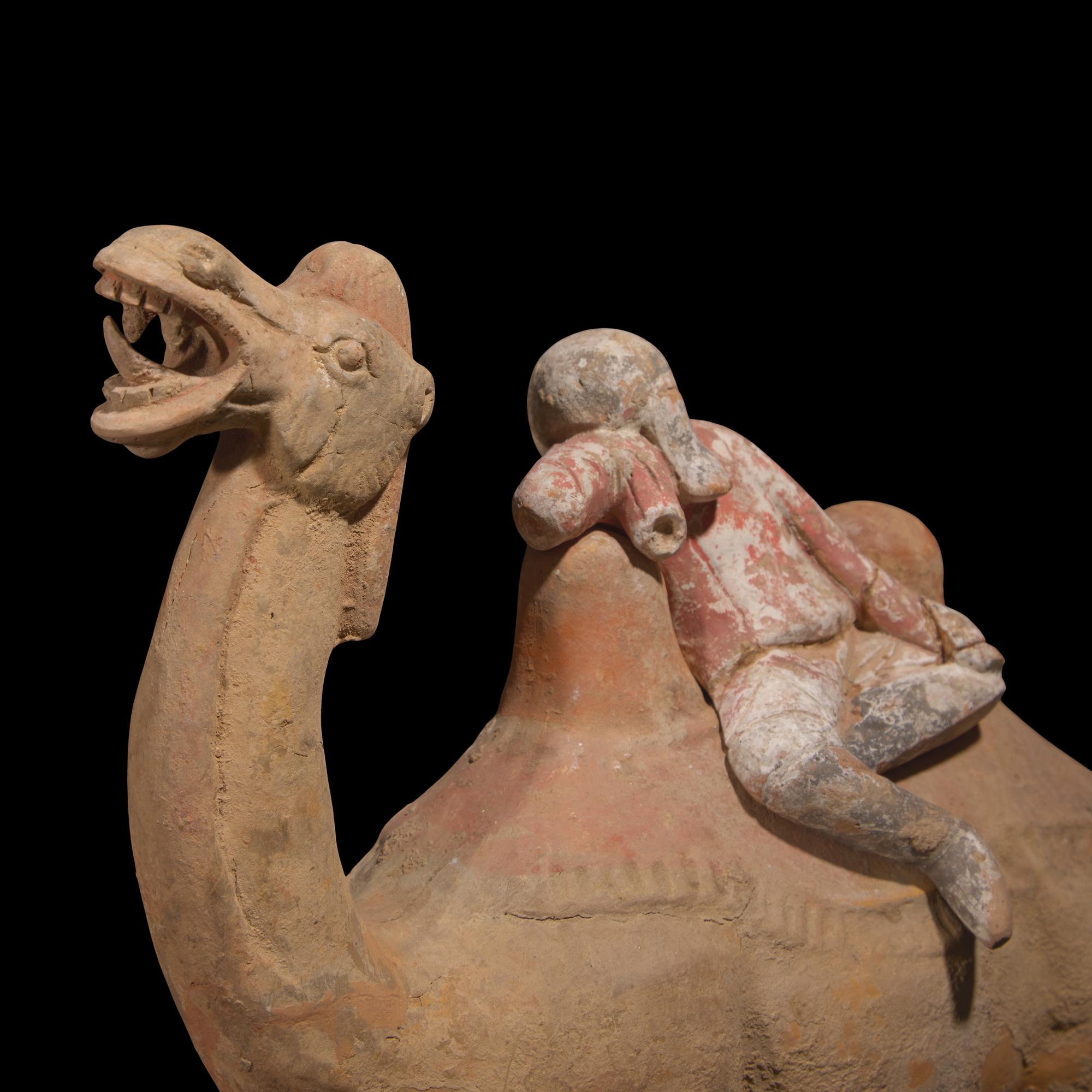 A Chinese Painted Pottery Figural Group of a Camel and a Rider, Possibly Tang Dynasty — 或為唐 陶加彩駱駝俑