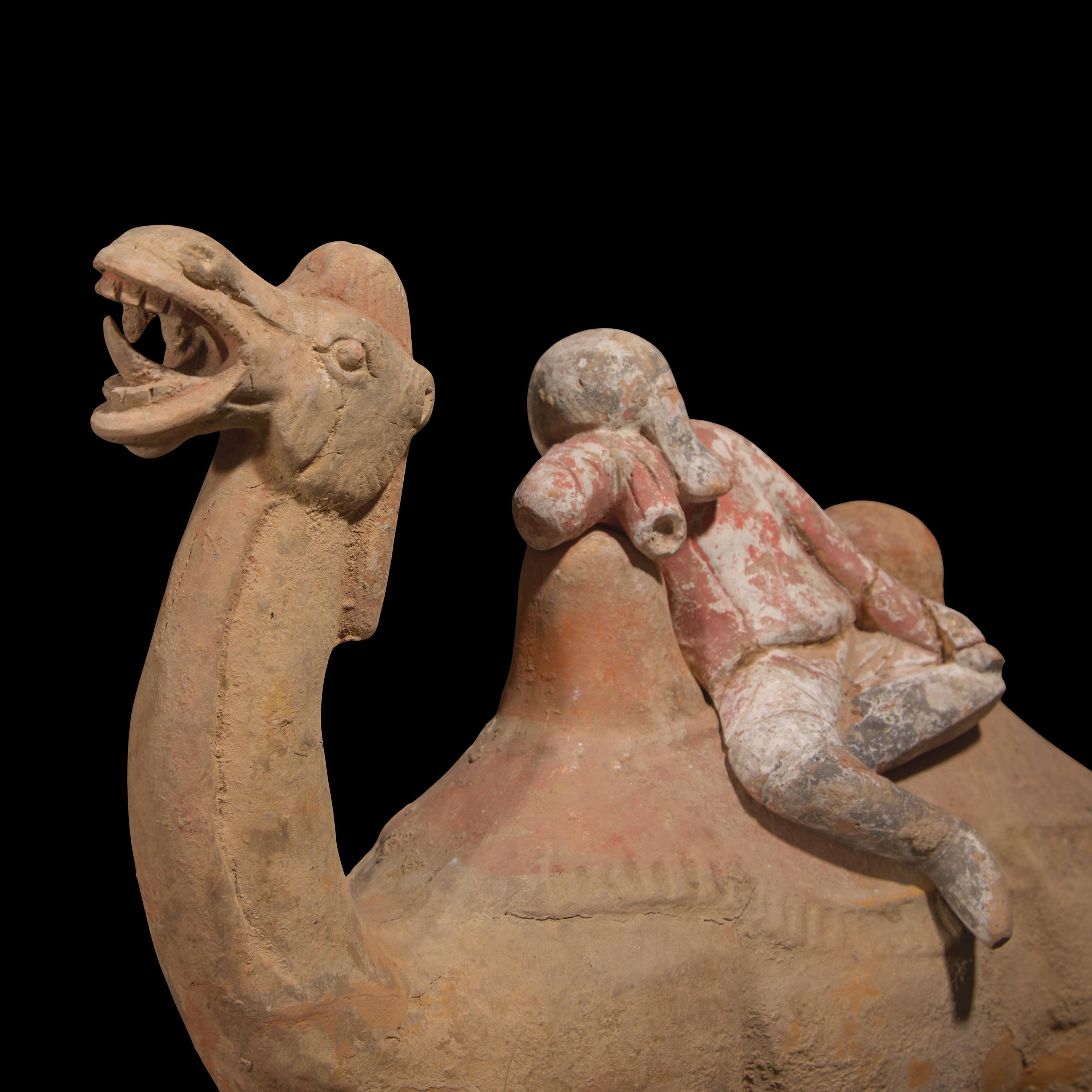A Chinese Painted Pottery Figural Group of a Camel and a Rider, Possibly Tang Dynasty — 或為唐 陶加彩駱駝俑