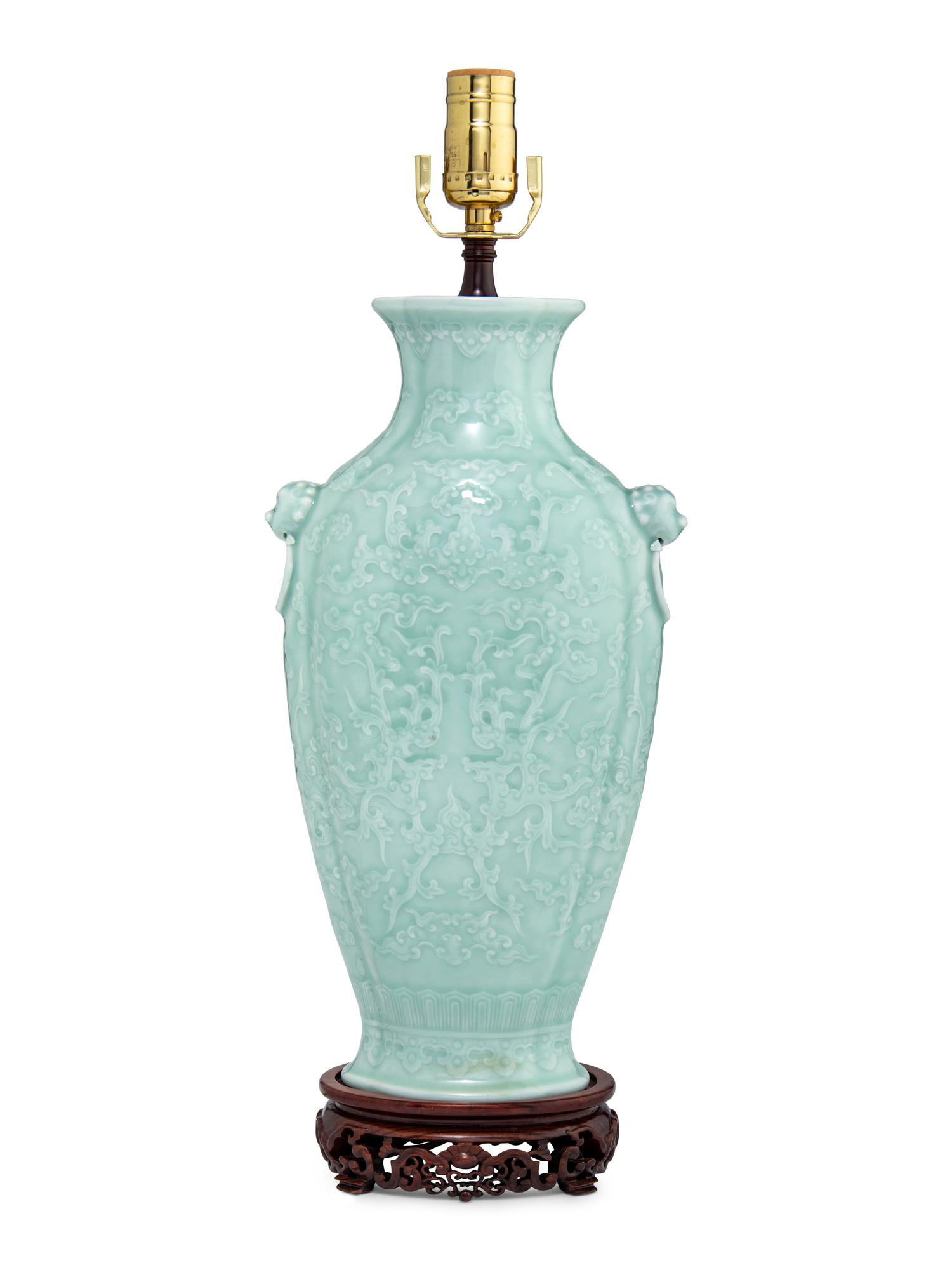 A Chinese Molded Celadon Ground Porcelain 'Phoenix' Vase