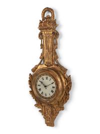 A Louis XVI Style Giltwood Cartel Clock