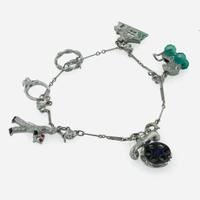 An Art Deco Platinum and Diamond Charm Bracelet