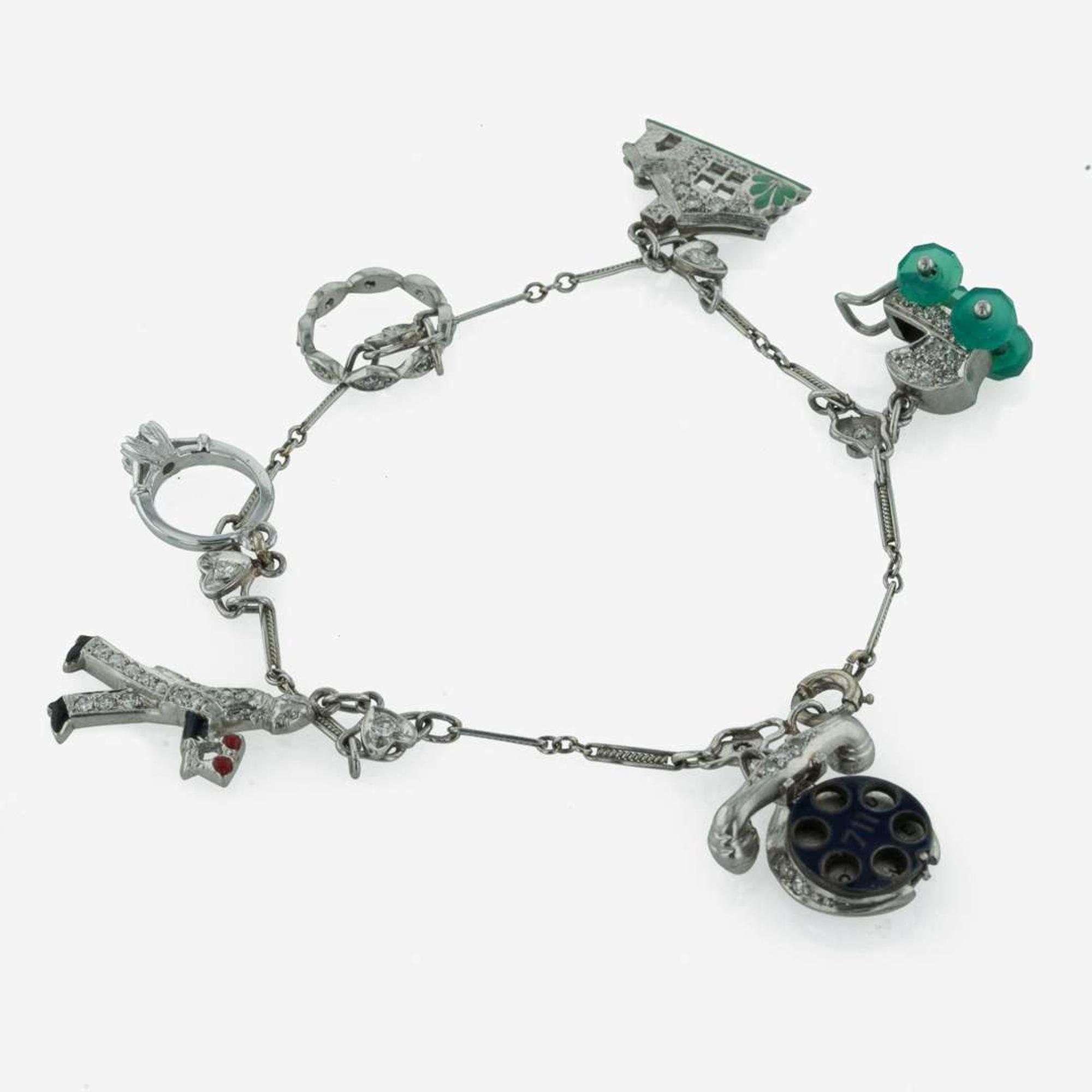 An Art Deco Platinum and Diamond Charm Bracelet