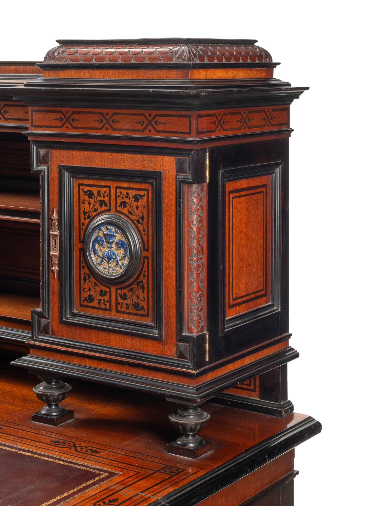 An English Aesthetic Movement Walnut, Part Ebonized and Glazed Earthenware Plaque-Inset Bureau Cabinet