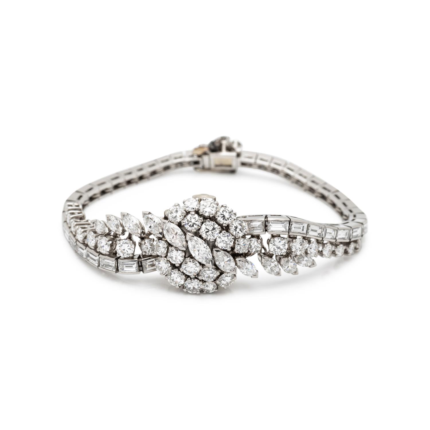 FRENCH, PLATINUM AND DIAMOND SURPRISE WATCH