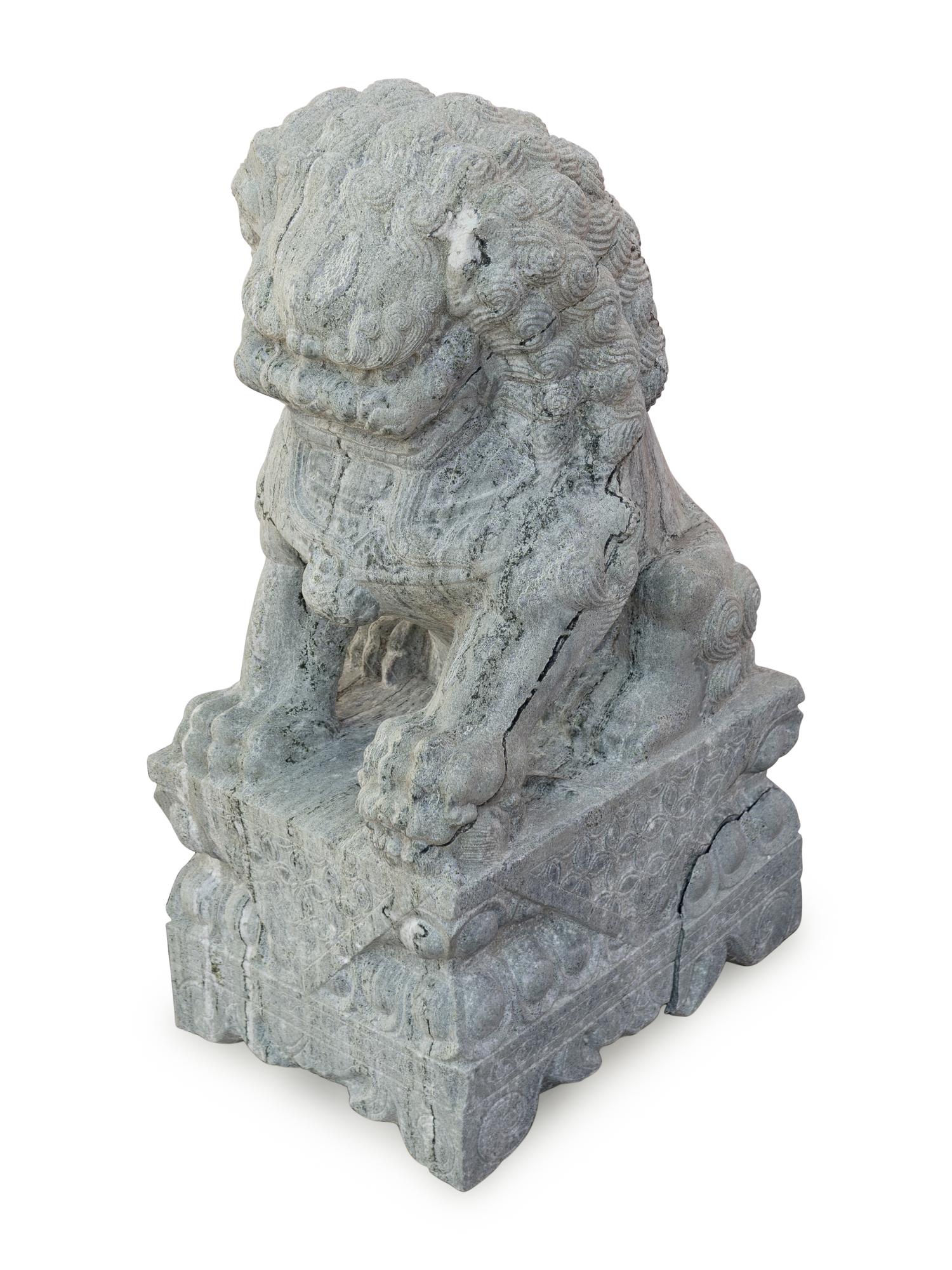 A Pair of Large Chinese Carved Green Marble Fu-Lions