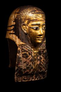 An Egyptian Gilt Cartonnage Mummy Mask