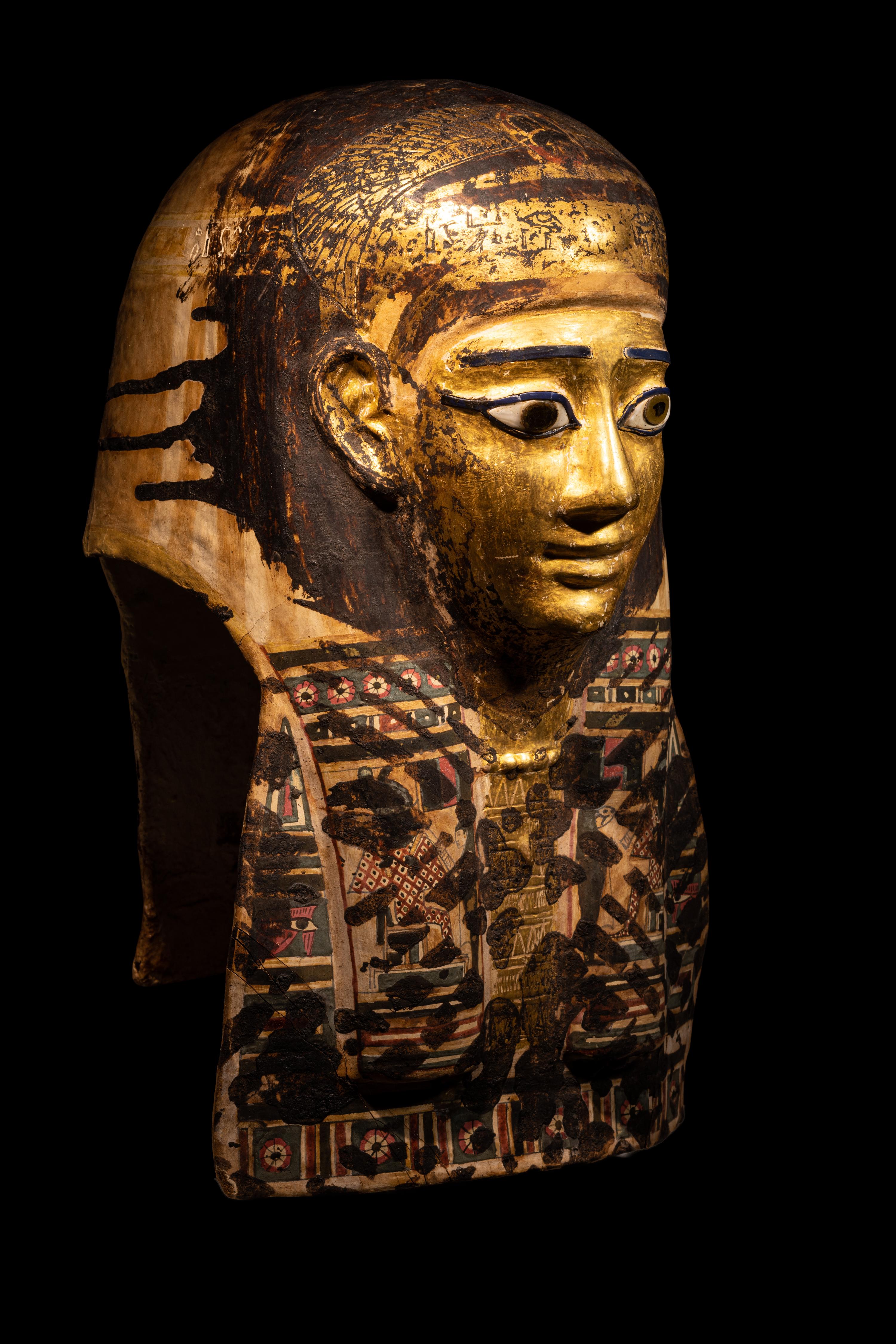 An Egyptian Gilt Cartonnage Mummy Mask