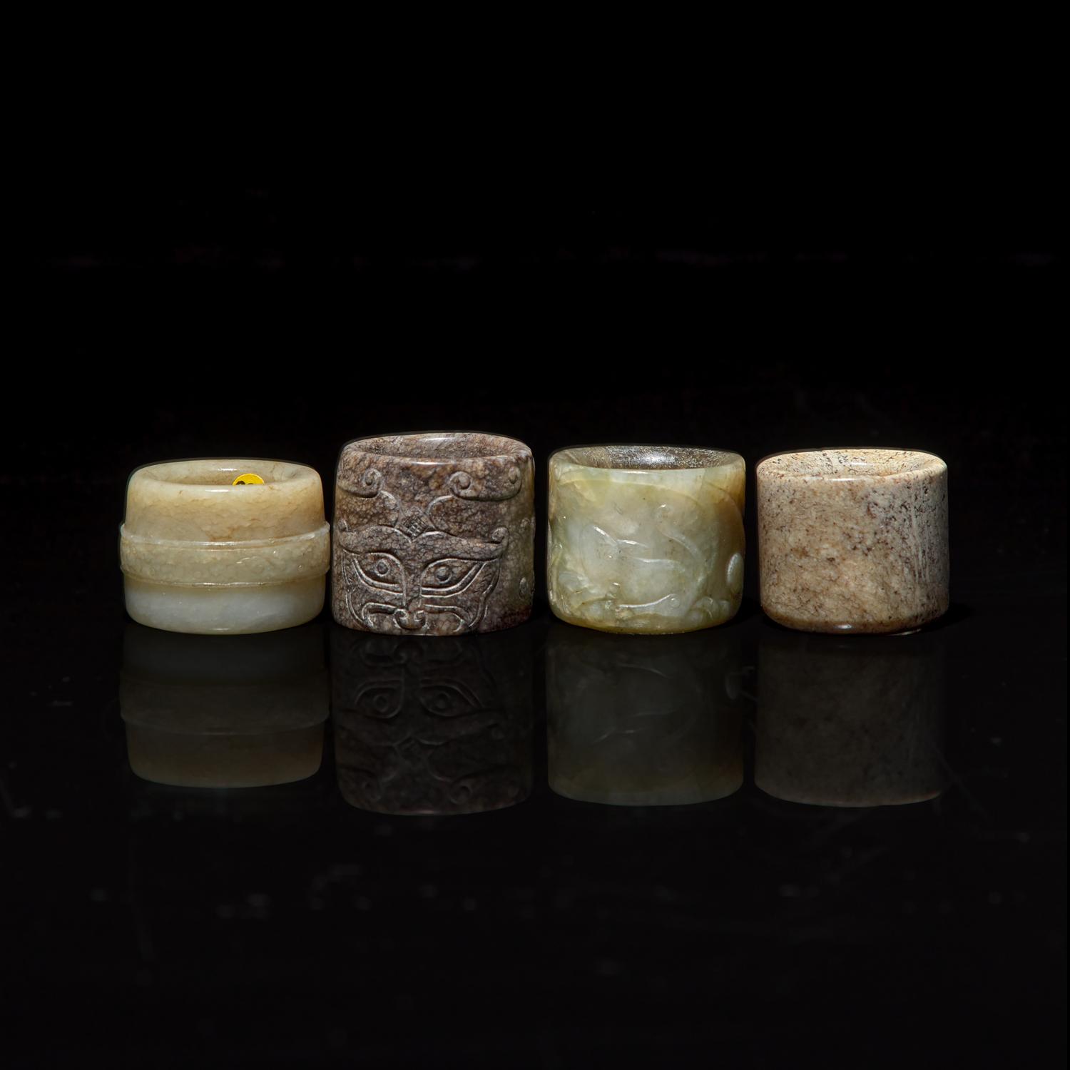 Four Chinese Carved Russet and Brown Jade Archer's Rings 帶沁灰玉扳指一組四枚