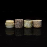 Four Chinese Carved Russet and Brown Jade Archer's Rings 帶沁灰玉扳指一組四枚