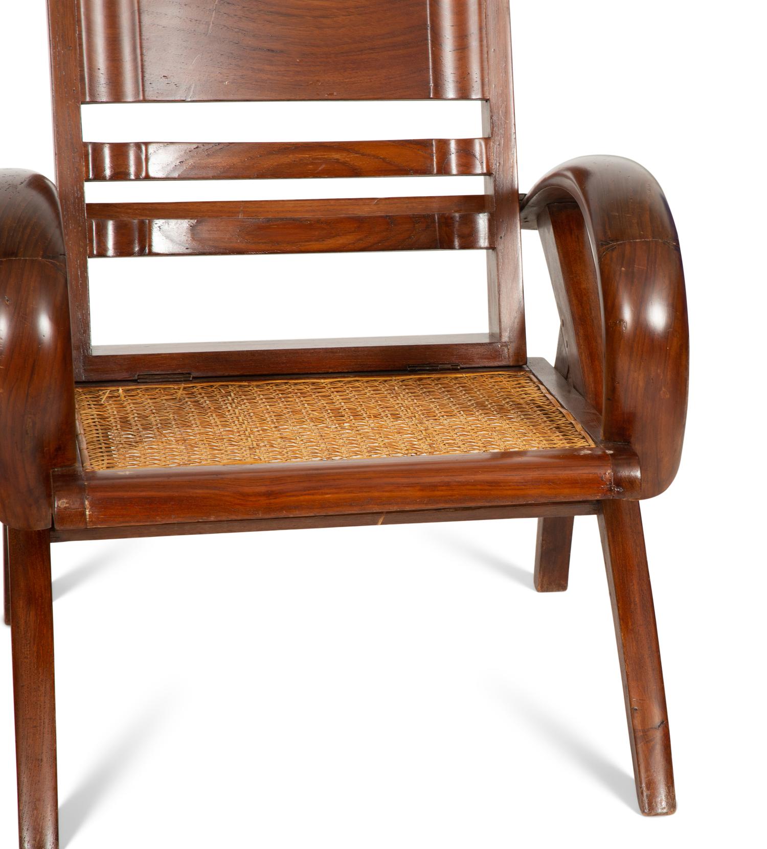 A Pair of Art Deco Walnut and Caned Folding Lounge Chairs