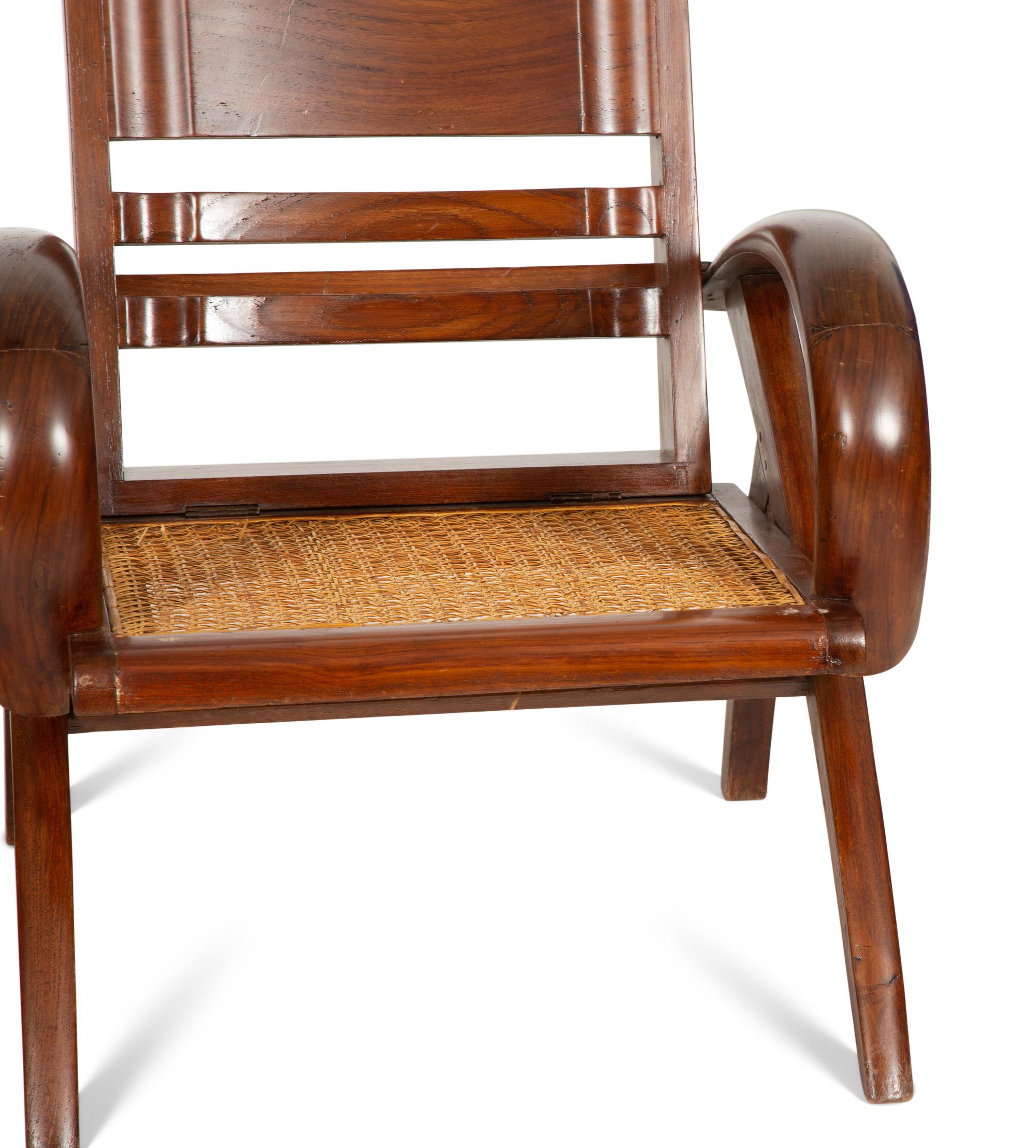 A Pair of Art Deco Walnut and Caned Folding Lounge Chairs