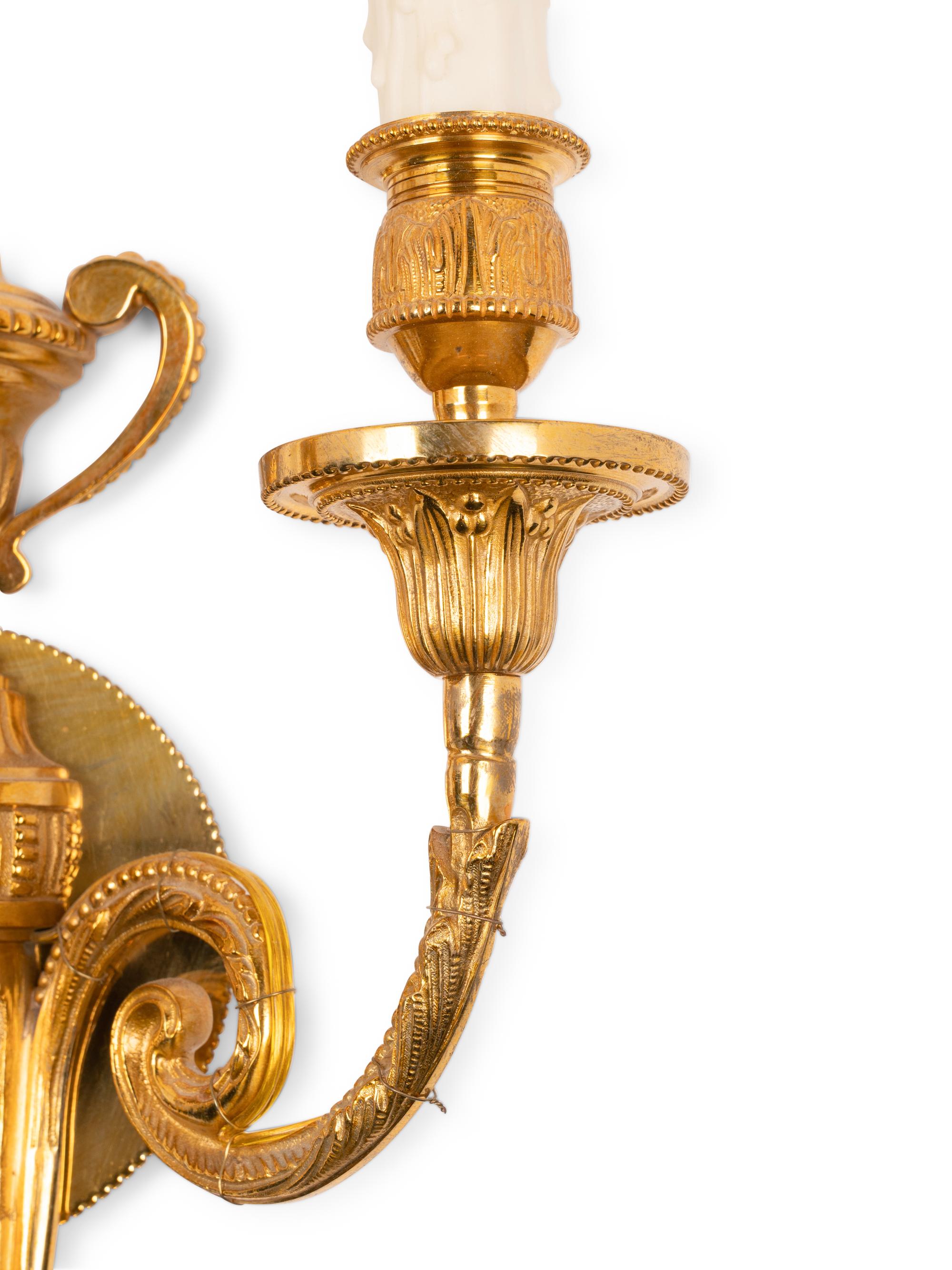 A Pair of Louis XVI Style Gilt Metal Two-Light Sconces