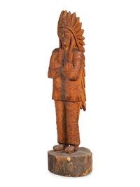 A Carved Wood Figure of an Indian by Don Colp (American, b. 1932)