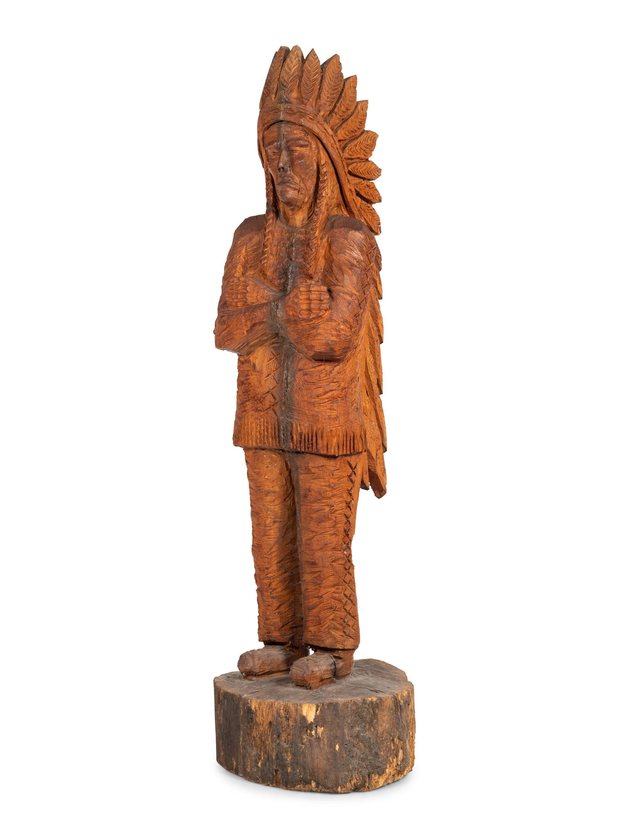 A Carved Wood Figure of an Indian by Don Colp (American, b. 1932)