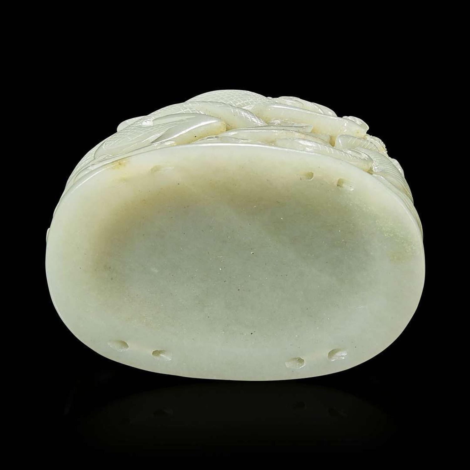 A Chinese pale celadon jade reticulated "Dragon" finial 青白玉镂空龙形炉端