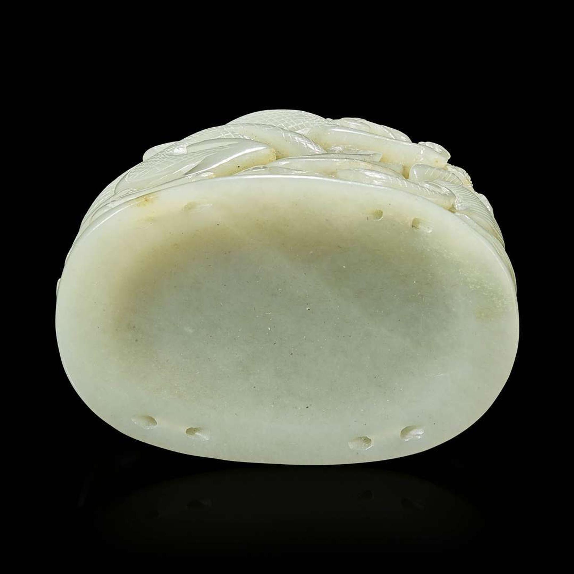 A Chinese pale celadon jade reticulated "Dragon" finial 青白玉镂空龙形炉端