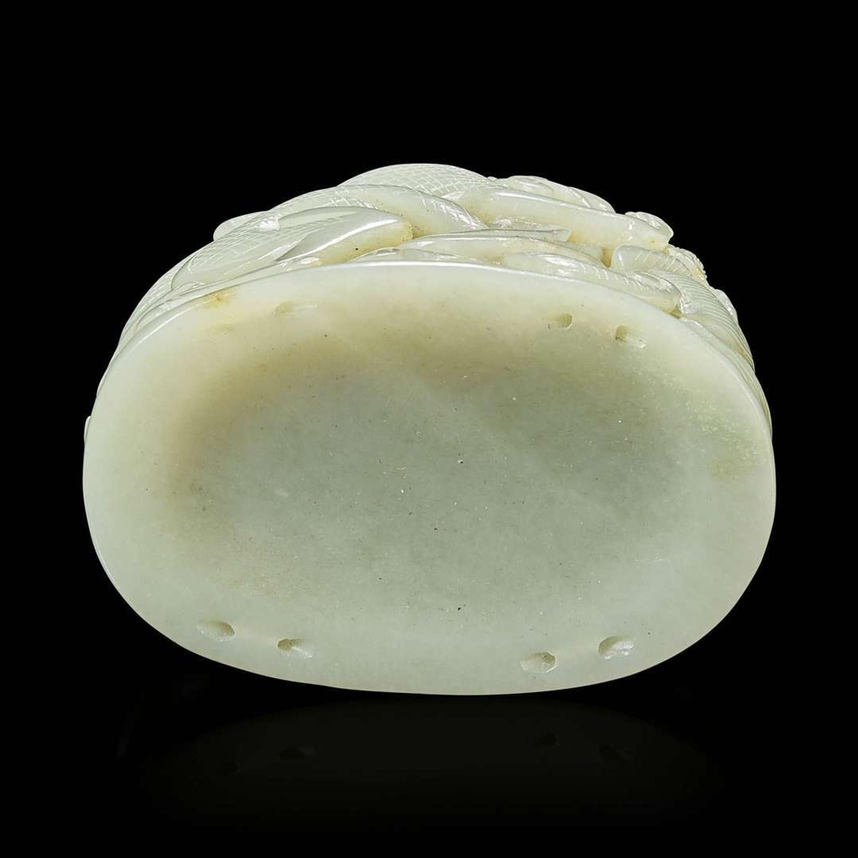 A Chinese pale celadon jade reticulated "Dragon" finial 青白玉镂空龙形炉端
