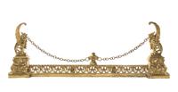 A Neoclassical Gilt Metal Fire Guard, Height of chenet 15 1/2 inches.