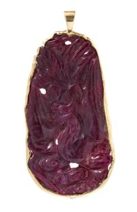 A Yellow Gold and Carved Ruby Pendant, 16.10 dwts.