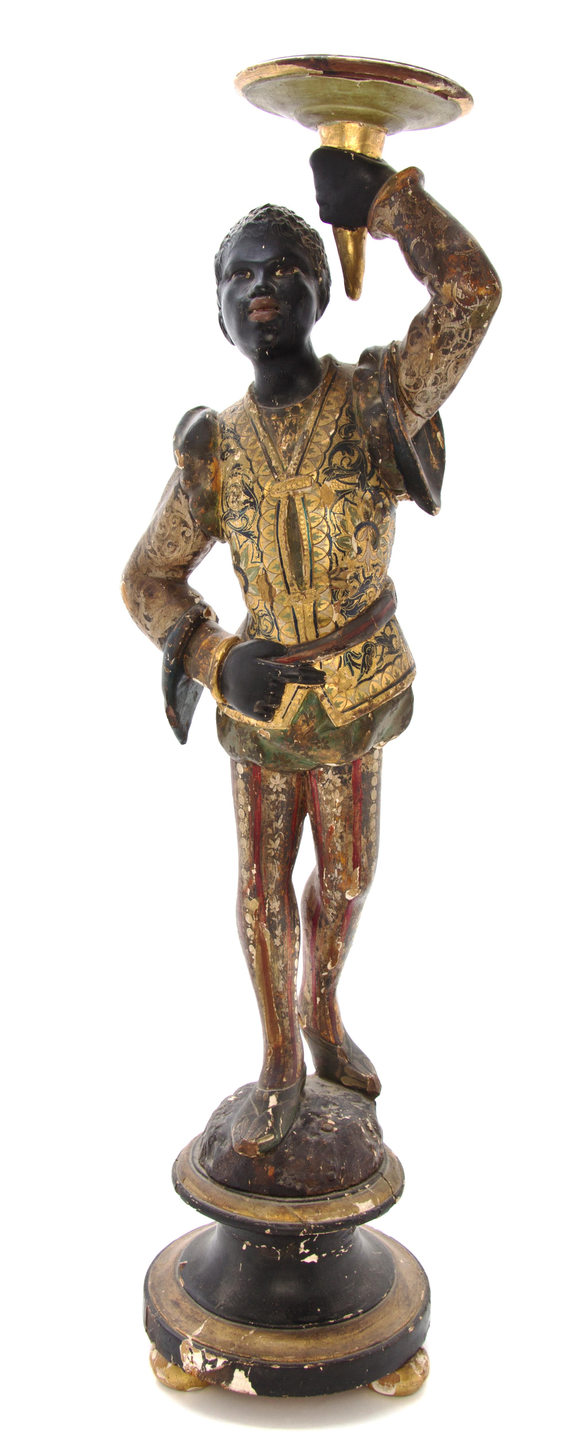 A Venetian Carved and Polychrome Decorated Figure, Height 29 3/4 inches.