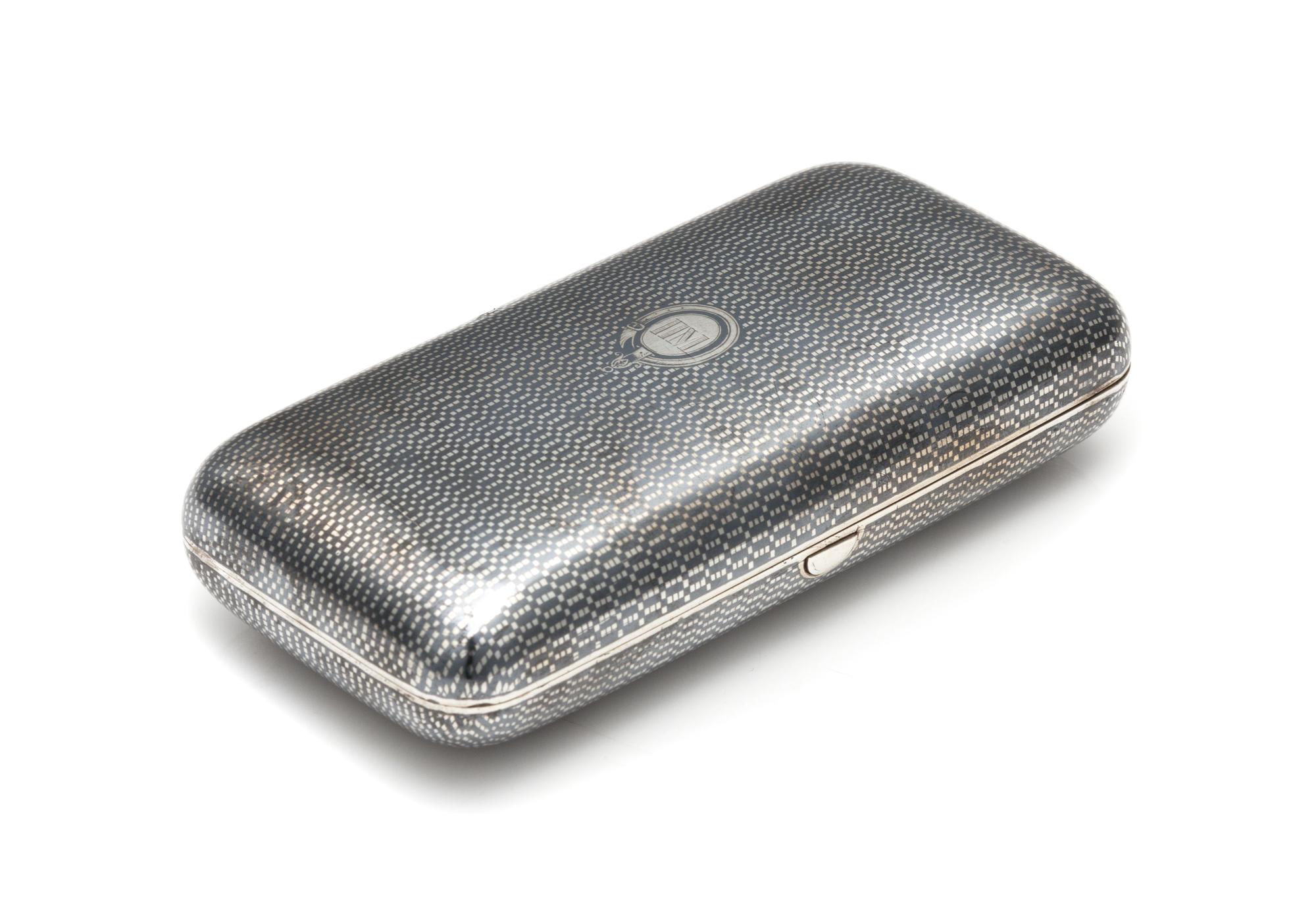 A Russian Niello Silver Cigarette Case, Maker's Mark Cyrillic P.Ch, Assay of Aleksandr Smirnov, Moscow, 1866, the patterned niello deco