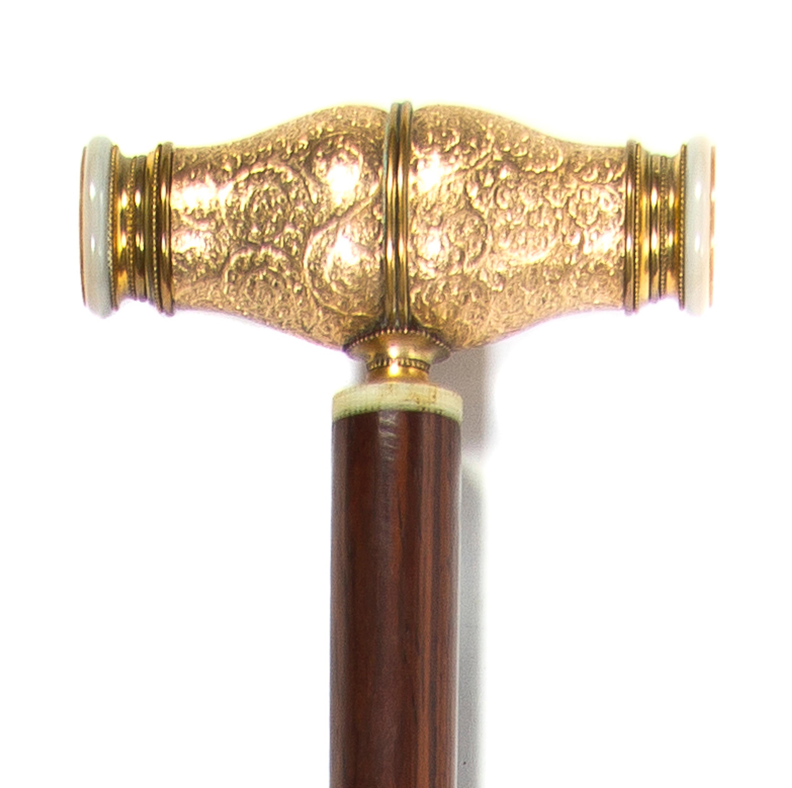 A French Gilt Metal and Mother-of-Pearl Monocular Mounted Cane, Height overall 36 3/8 x width of handle 4 1/2 inches.