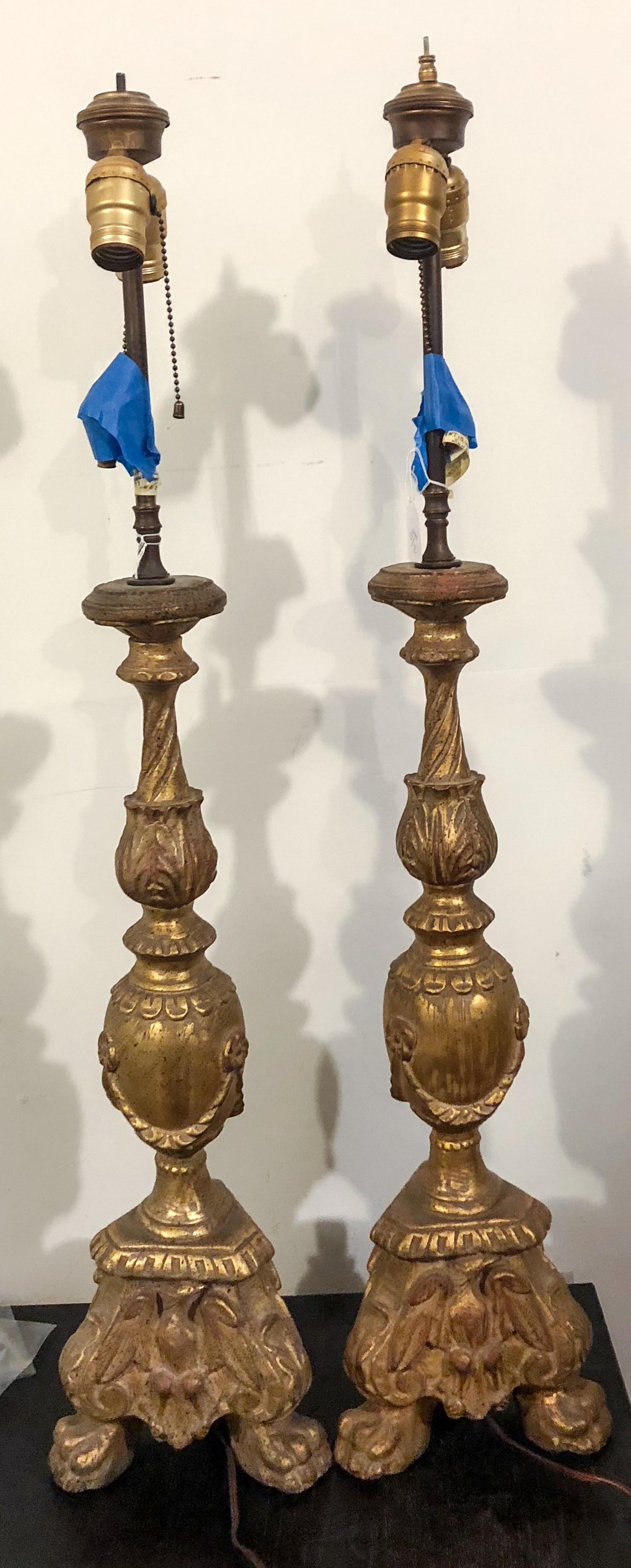 A Pair of Giltwood Prickets Height overall 38 inches. — FIRST HALF 20TH CENTURY