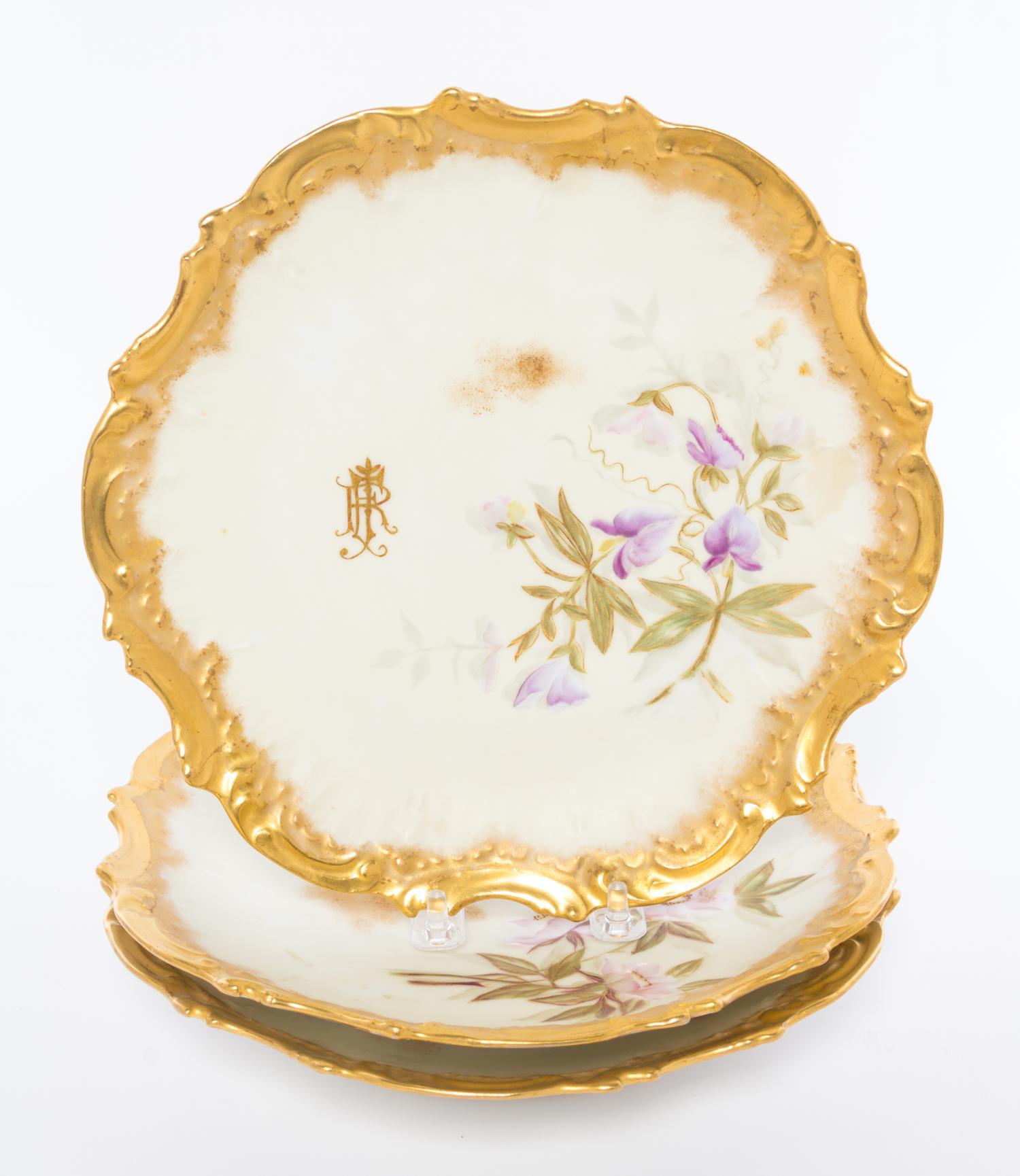 A Group of Three Limoges Plates Diameter 9 inches.