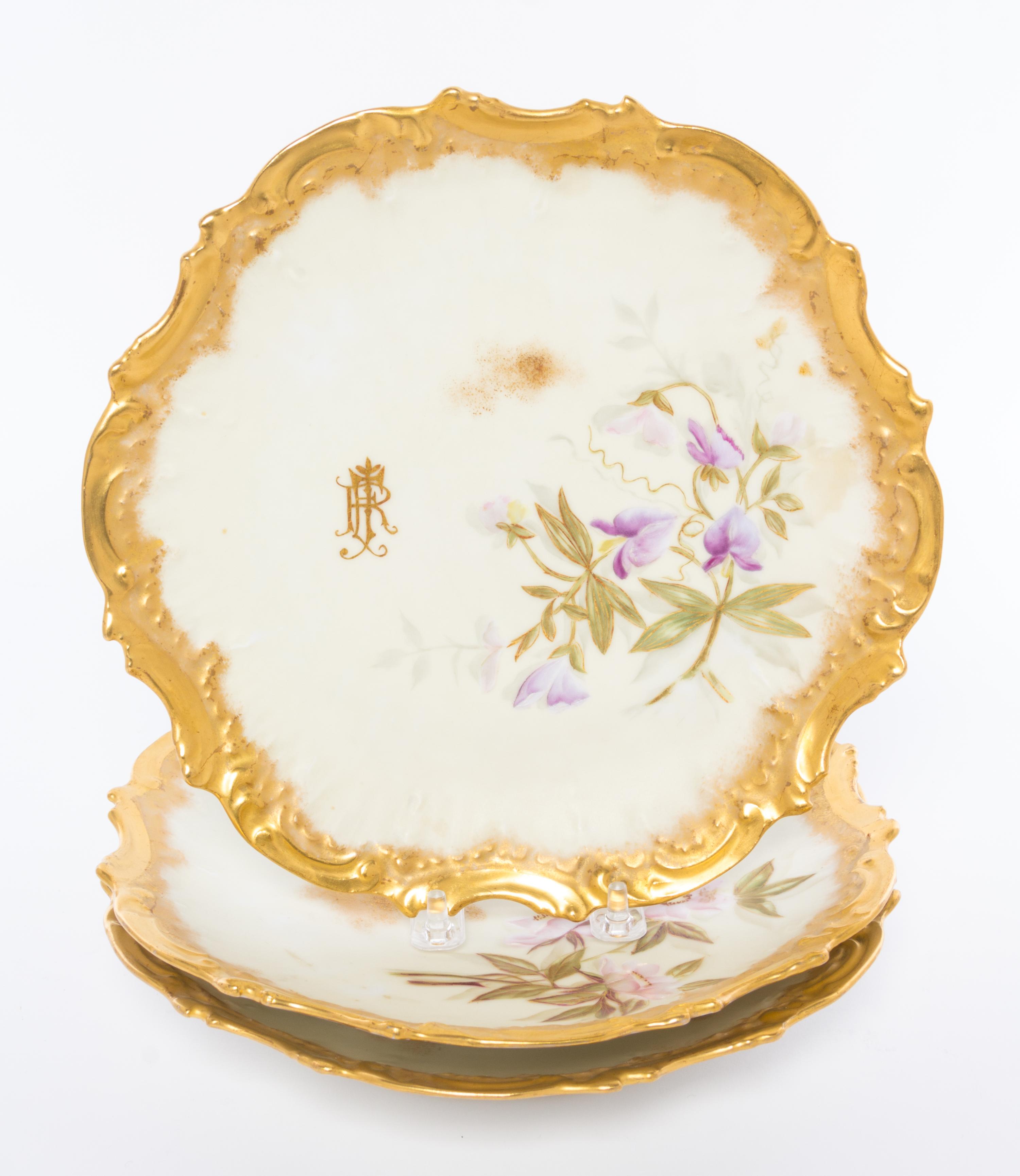 A Group of Three Limoges Plates Diameter 9 inches.