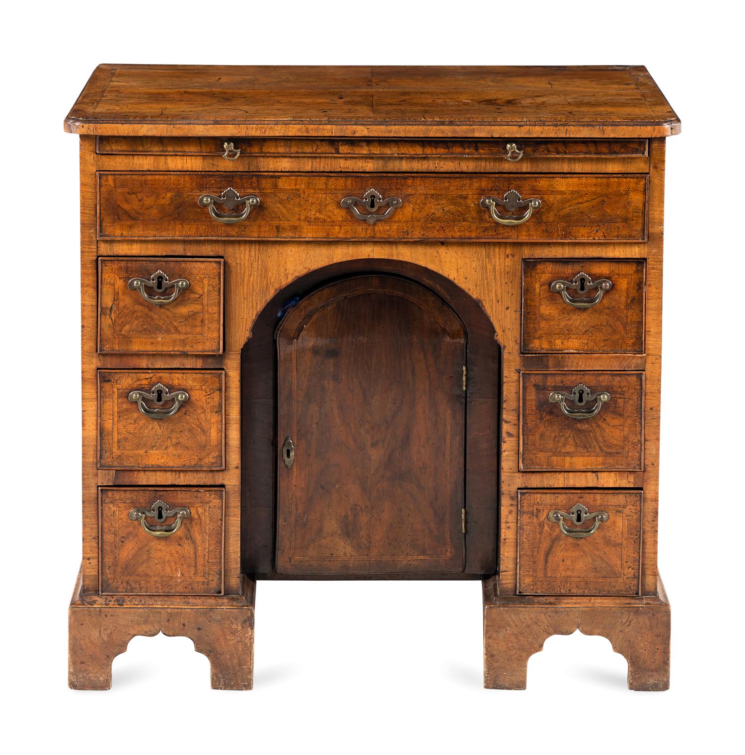 A George I Walnut Kneehole Desk