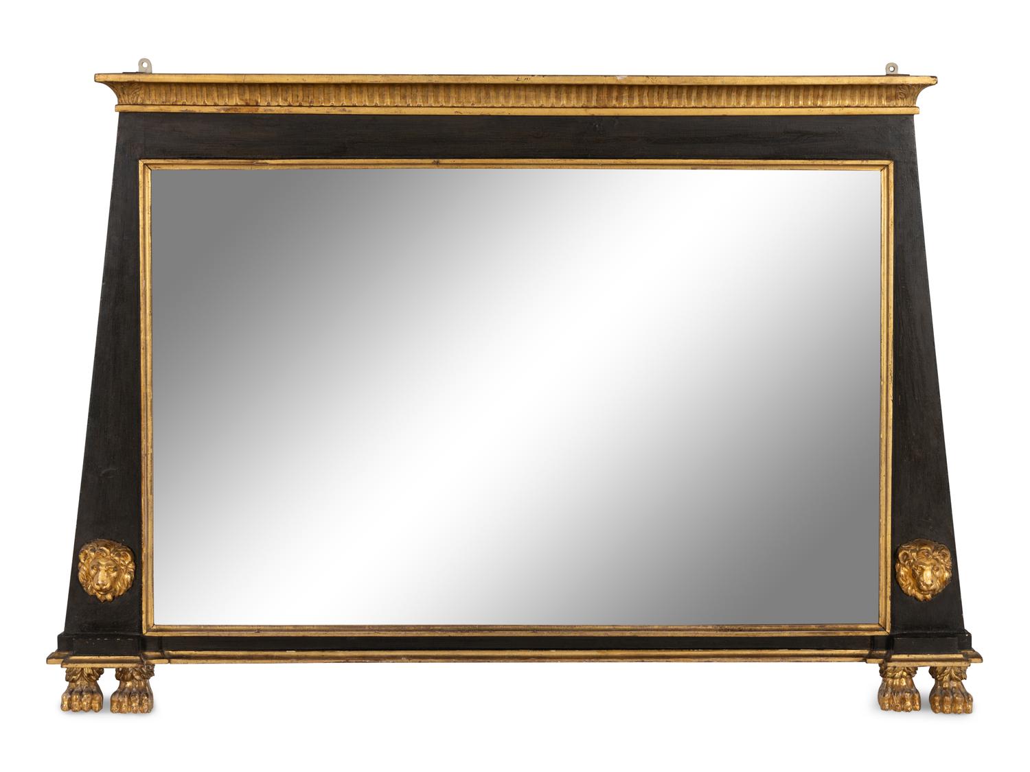 An Egyptian Revival Parcel Gilt and Ebonized Lion and Paw Decorated Over Mantel Mirror