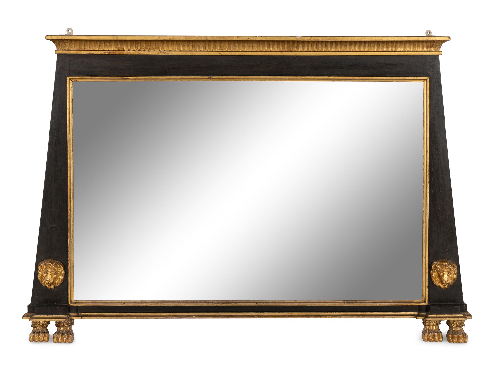An Egyptian Revival Parcel Gilt and Ebonized Lion and Paw Decorated Over Mantel Mirror