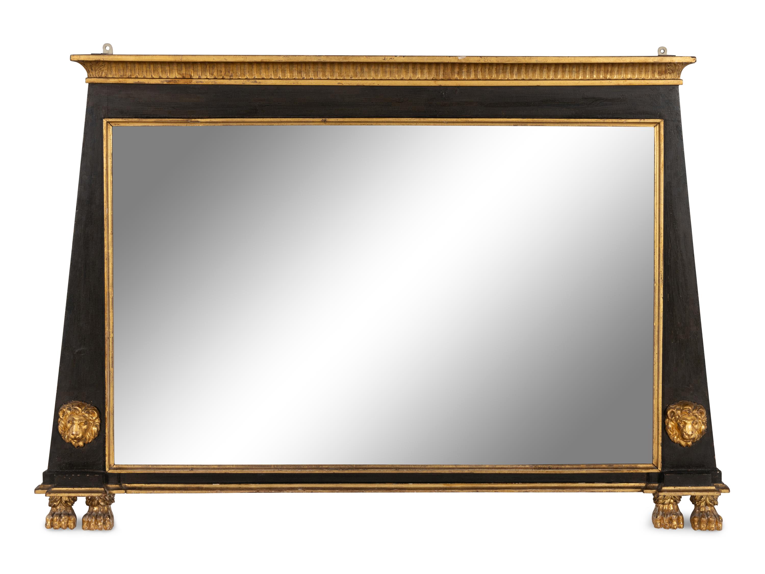 An Egyptian Revival Parcel Gilt and Ebonized Lion and Paw Decorated Over Mantel Mirror