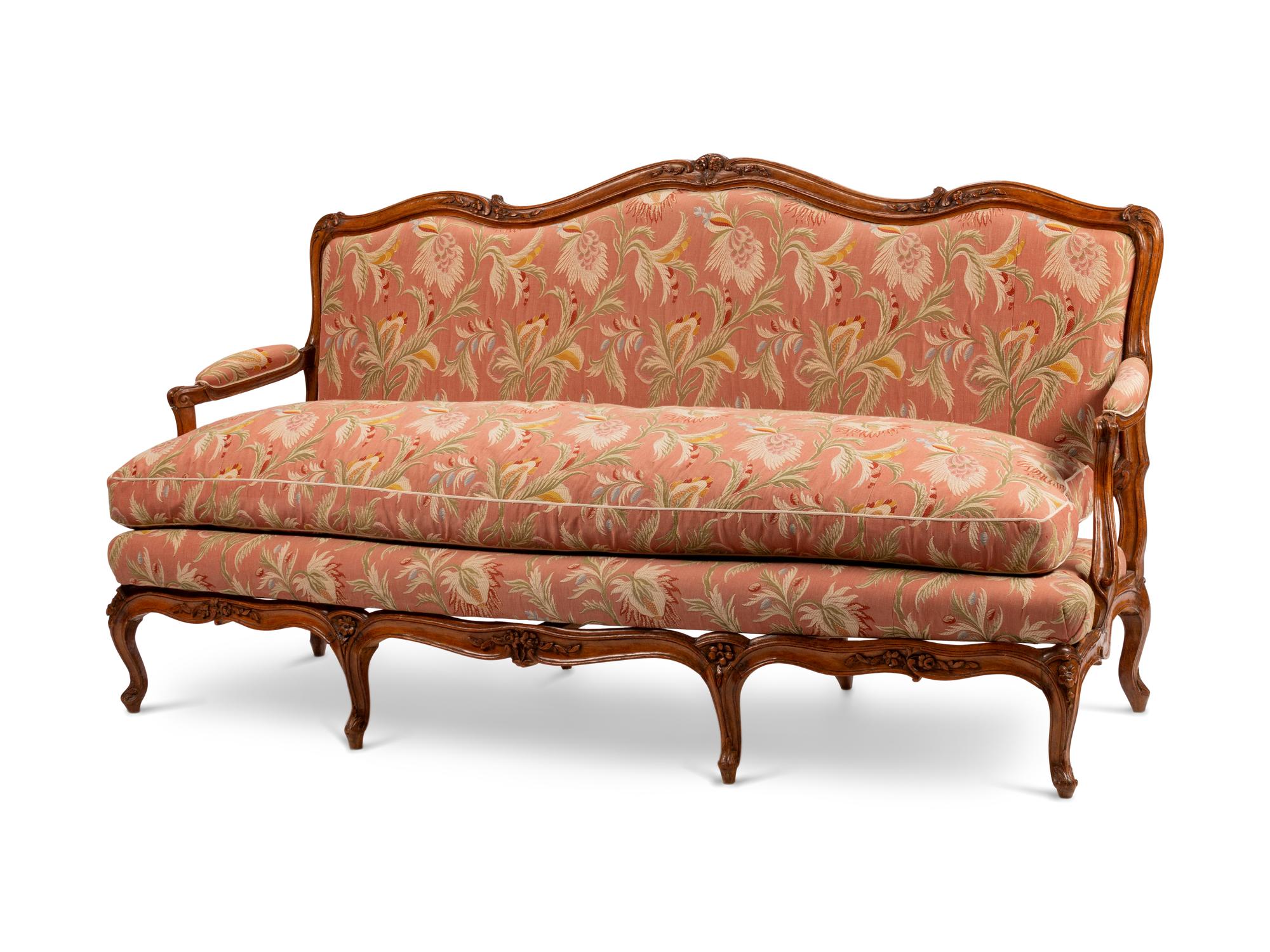 A Louis XV Provincial Carved Walnut Canapé — 19TH CENTURY