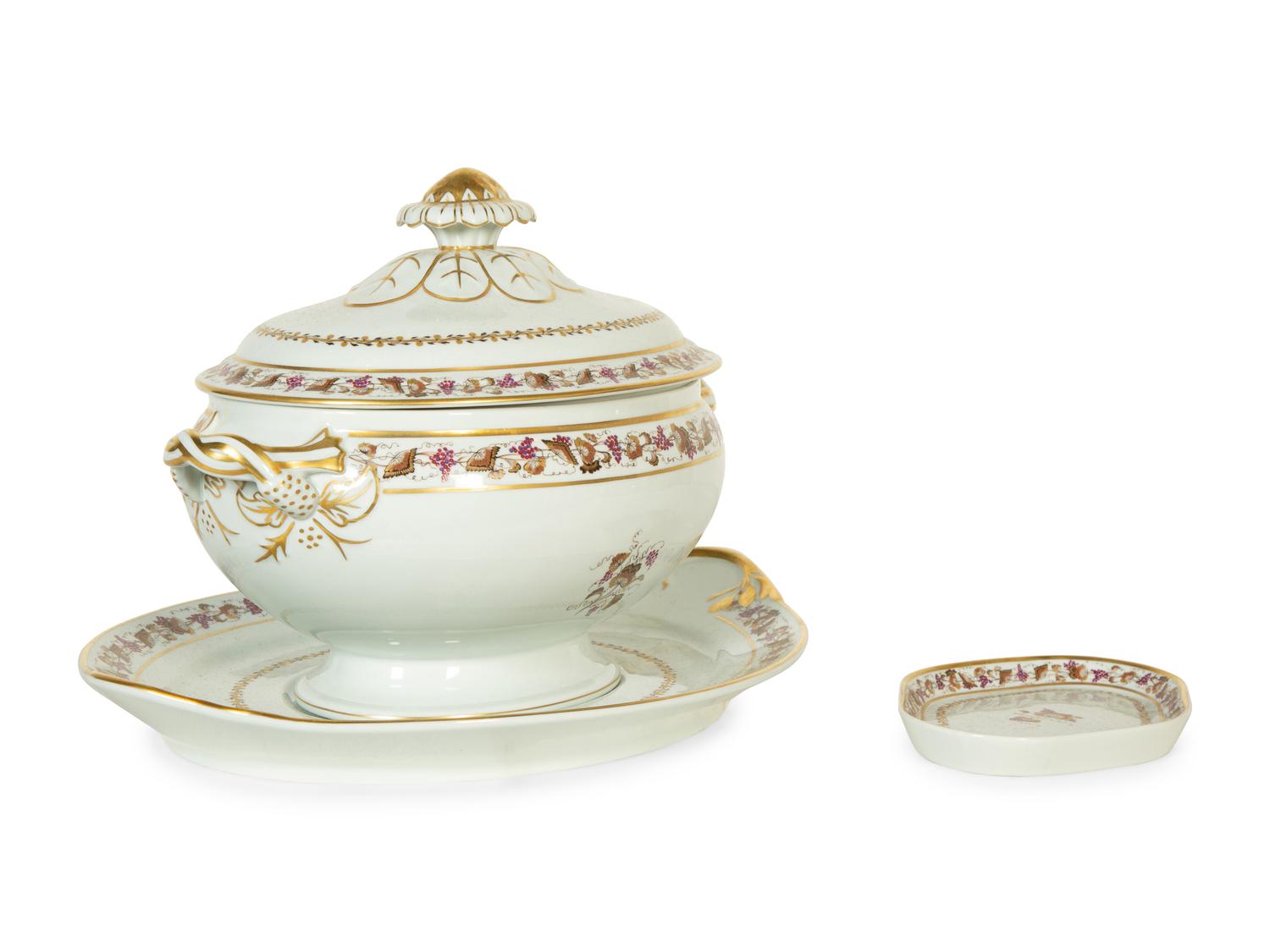 A Mottahedeh Porcelain Tureen, Underplate, and Spoon Rest