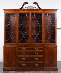 A Baker Mahogany Breakfront Bookcase Height 93 1/2 x width 75 x depth 14 3/4 inches. — MID-20TH CENTURY
