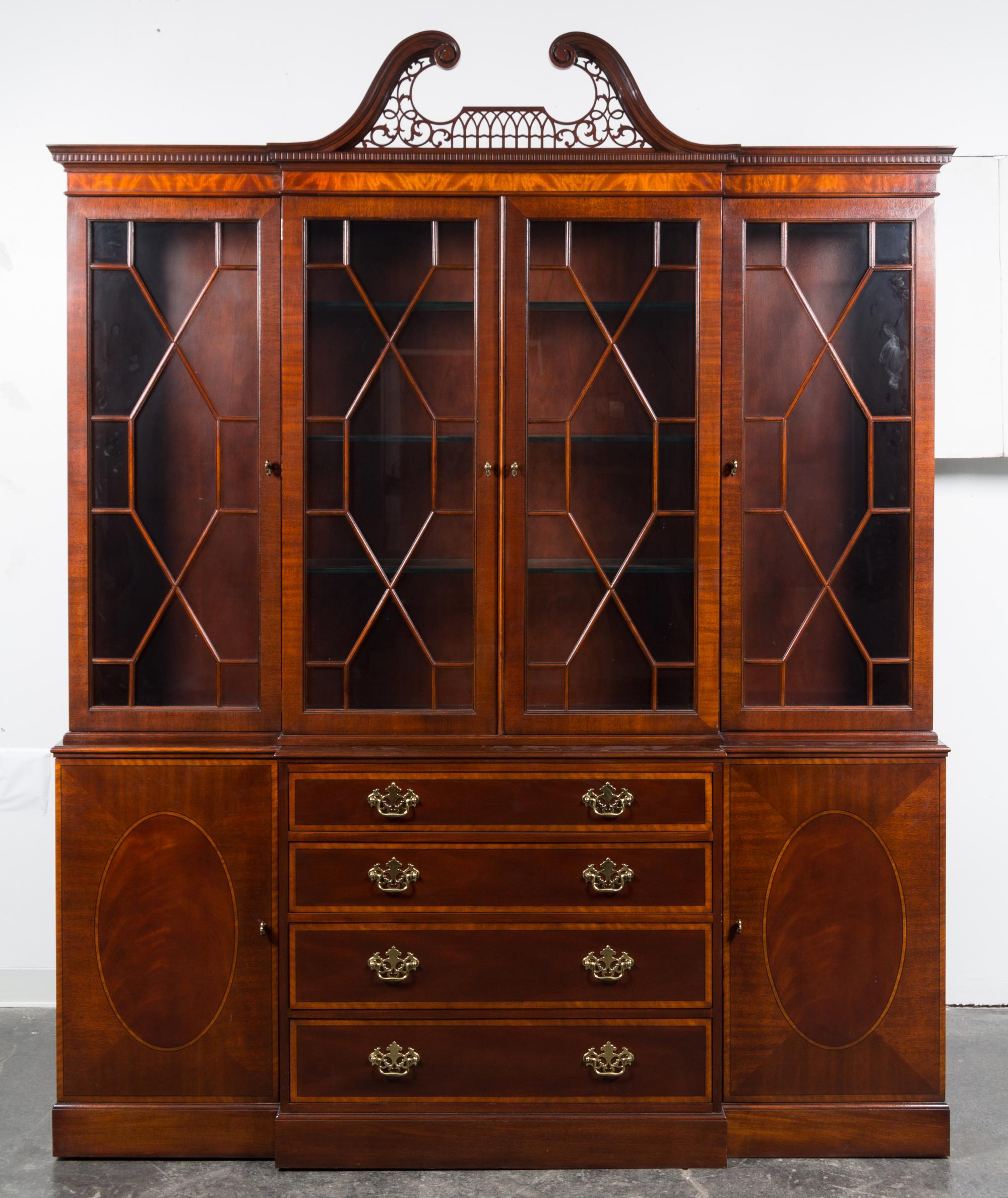 A Baker Mahogany Breakfront Bookcase Height 93 1/2 x width 75 x depth 14 3/4 inches. — MID-20TH CENTURY