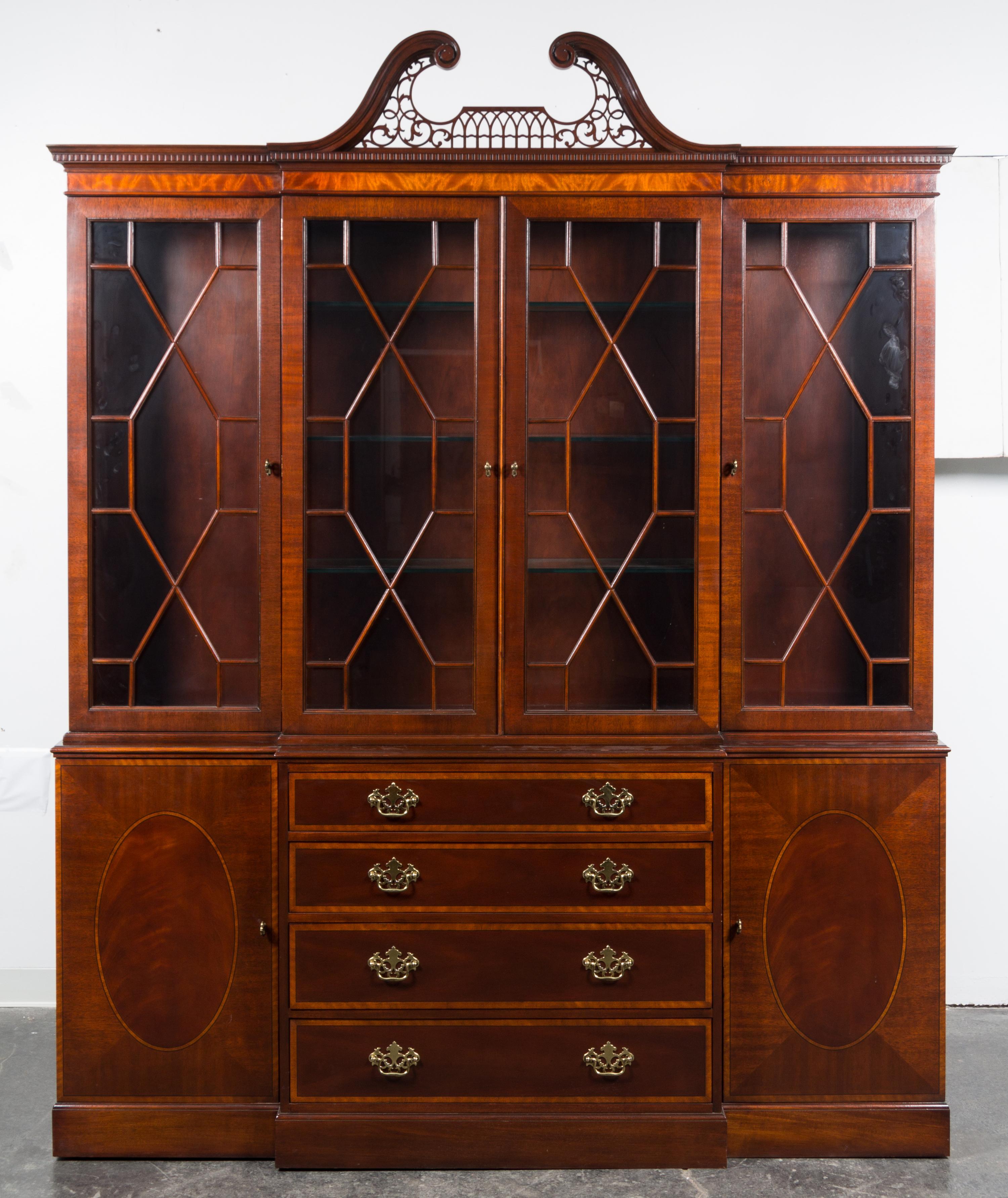 A Baker Mahogany Breakfront Bookcase Height 93 1/2 x width 75 x depth 14 3/4 inches. — MID-20TH CENTURY