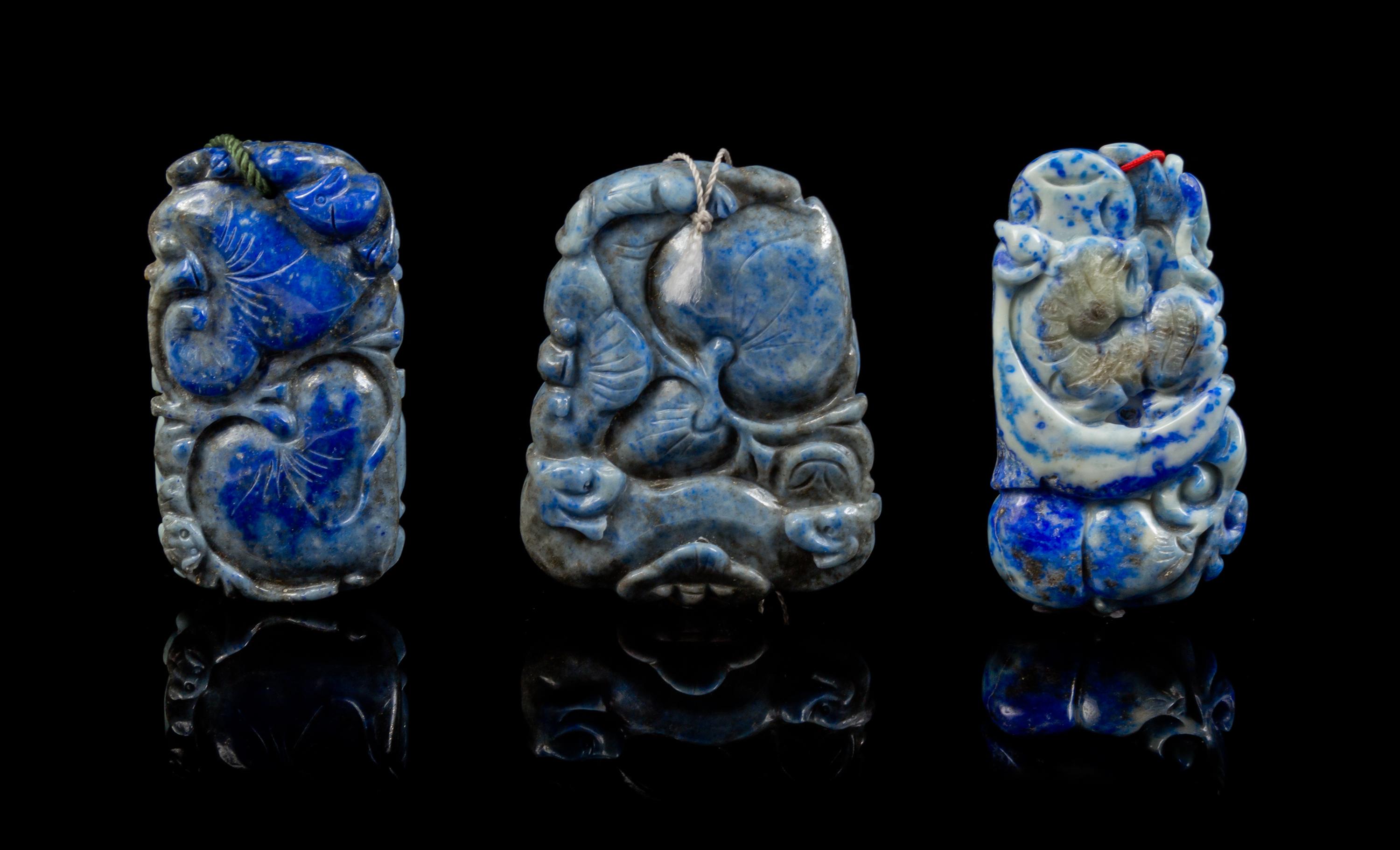 A Group of Three Carved Lapis Lazuli Pendants Length of first 2 5/8 inches.
