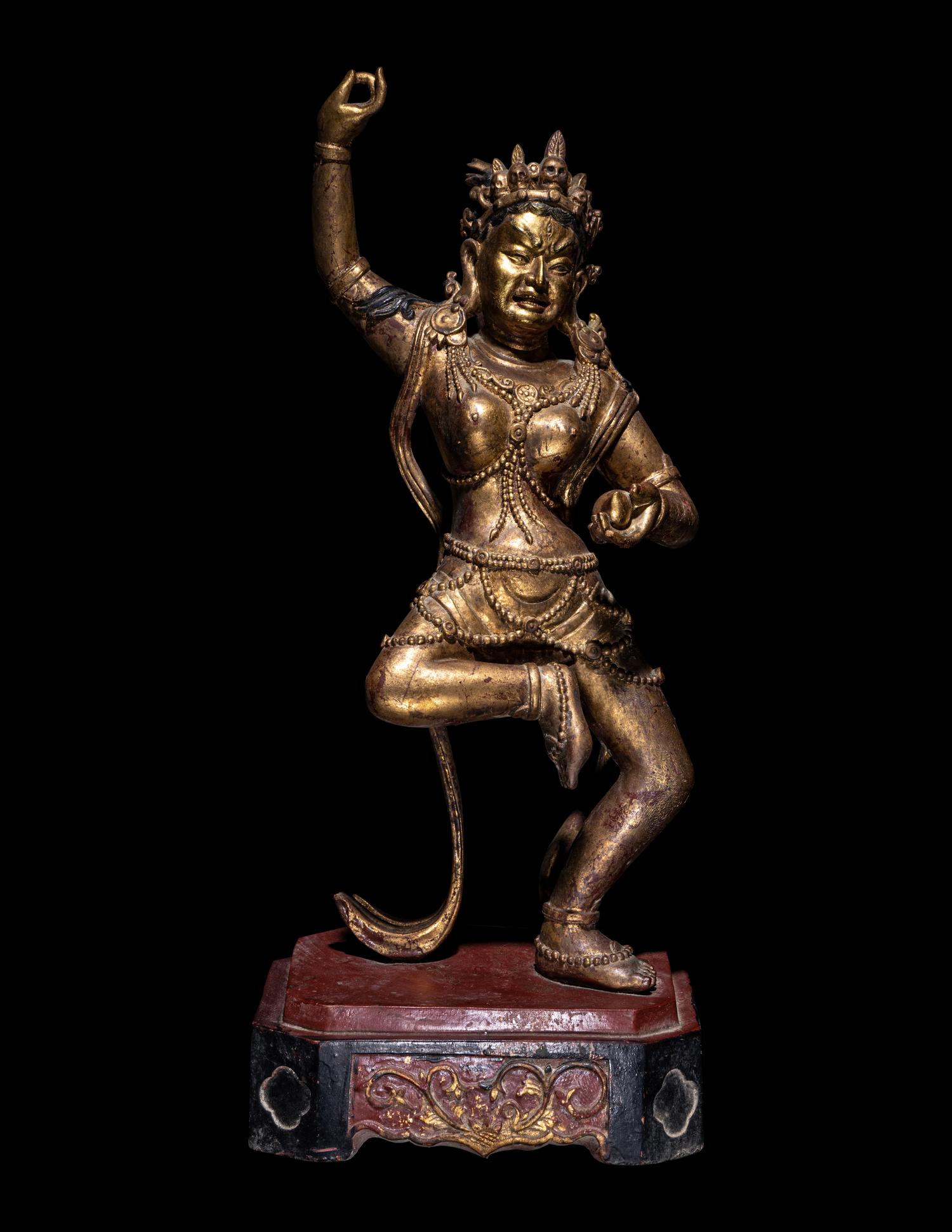 A Tibetan Gilt Lacquered Wood Figure of a Dancing Deity