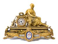A Napoleon III Porcelain Mounted Gilt Bronze Figural Mantel Clock Height 17 x width 24 3/4 x depth 9 inches. — 19TH CENTURY