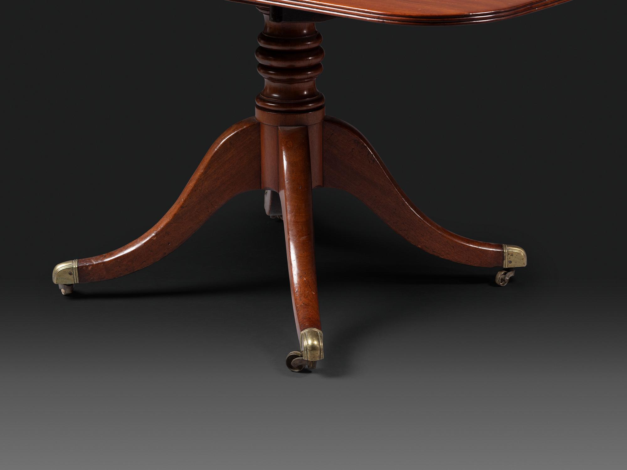 A Federal Mahogany Double Pedestal Extension Dining Table