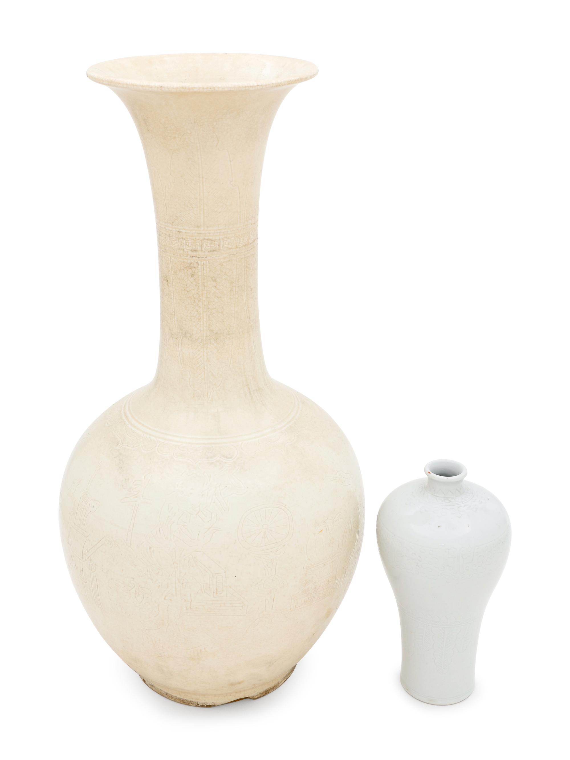 Two White Glazed Anhua Decorated Vases