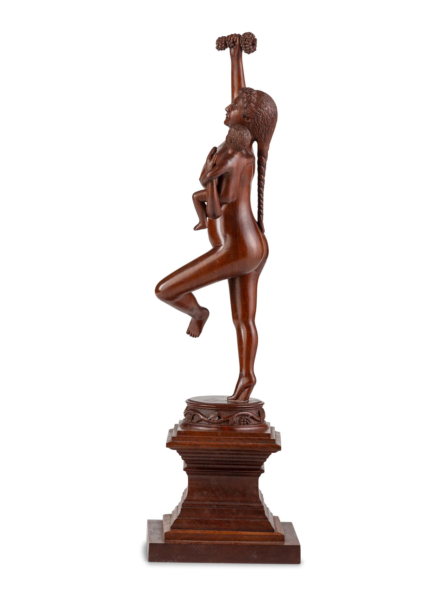An American Carved Cherrywood Bacchante and Infant Sculpture