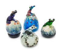 John Nygren, (American), a group of four paperweights, each with applied frog decoration
