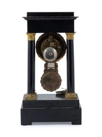 An Empire Style Gilt Metal Mounted Ebonized Mantel Clock