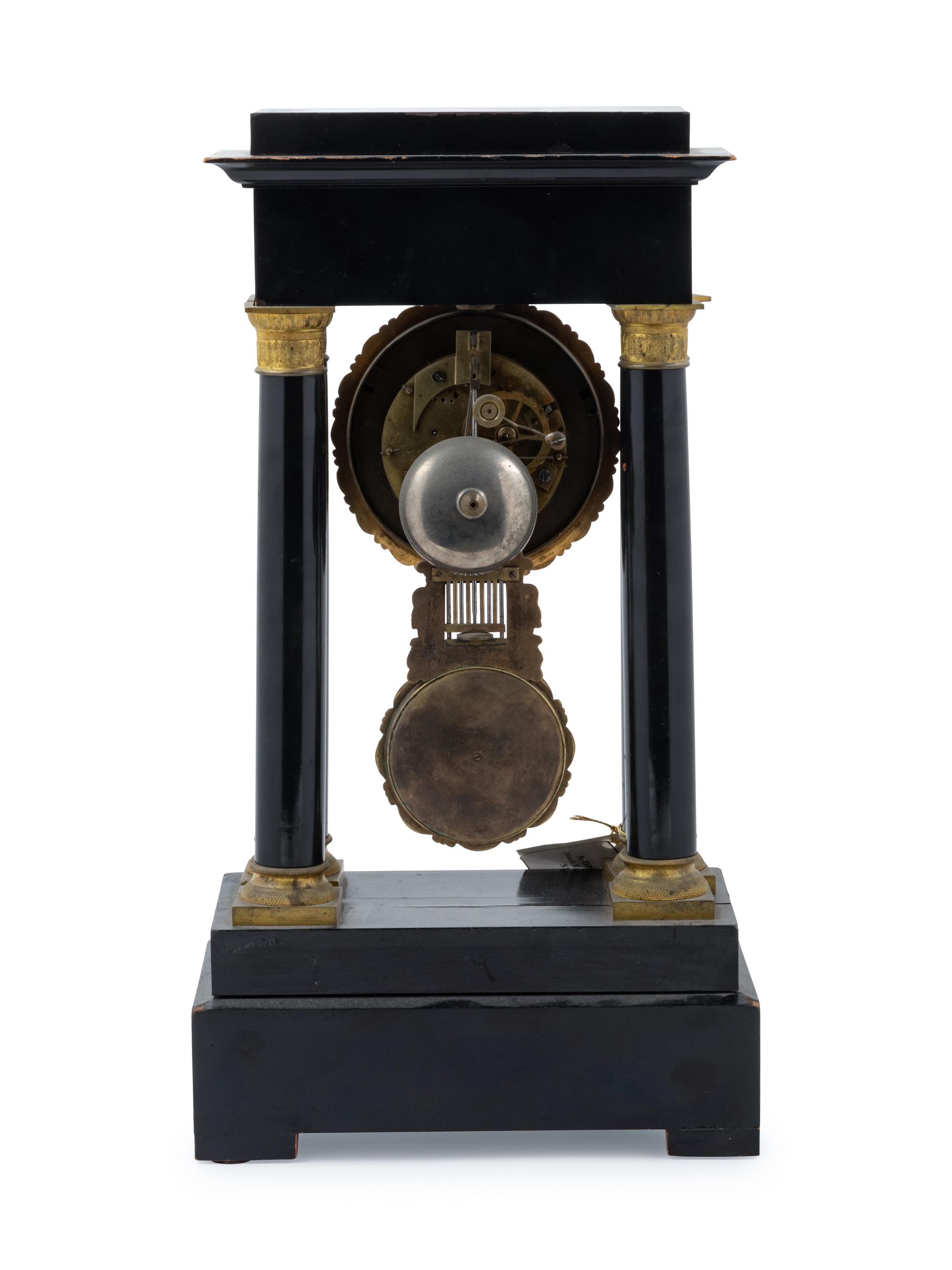An Empire Style Gilt Metal Mounted Ebonized Mantel Clock