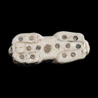 A Mesopotamian Marble and Lapis Lazuli Inlay Recumbent Feline
