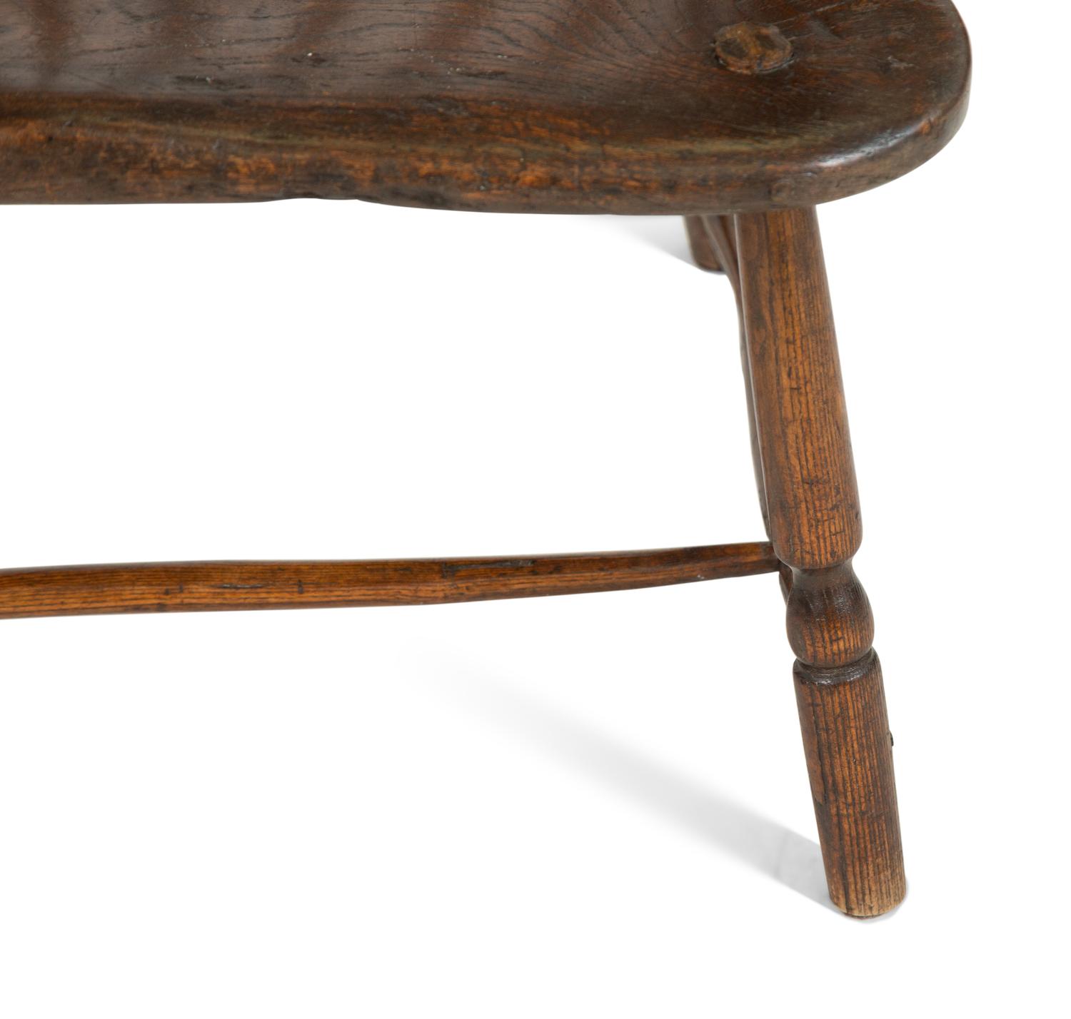 A George III Oak Comb-Back Windsor Armchair