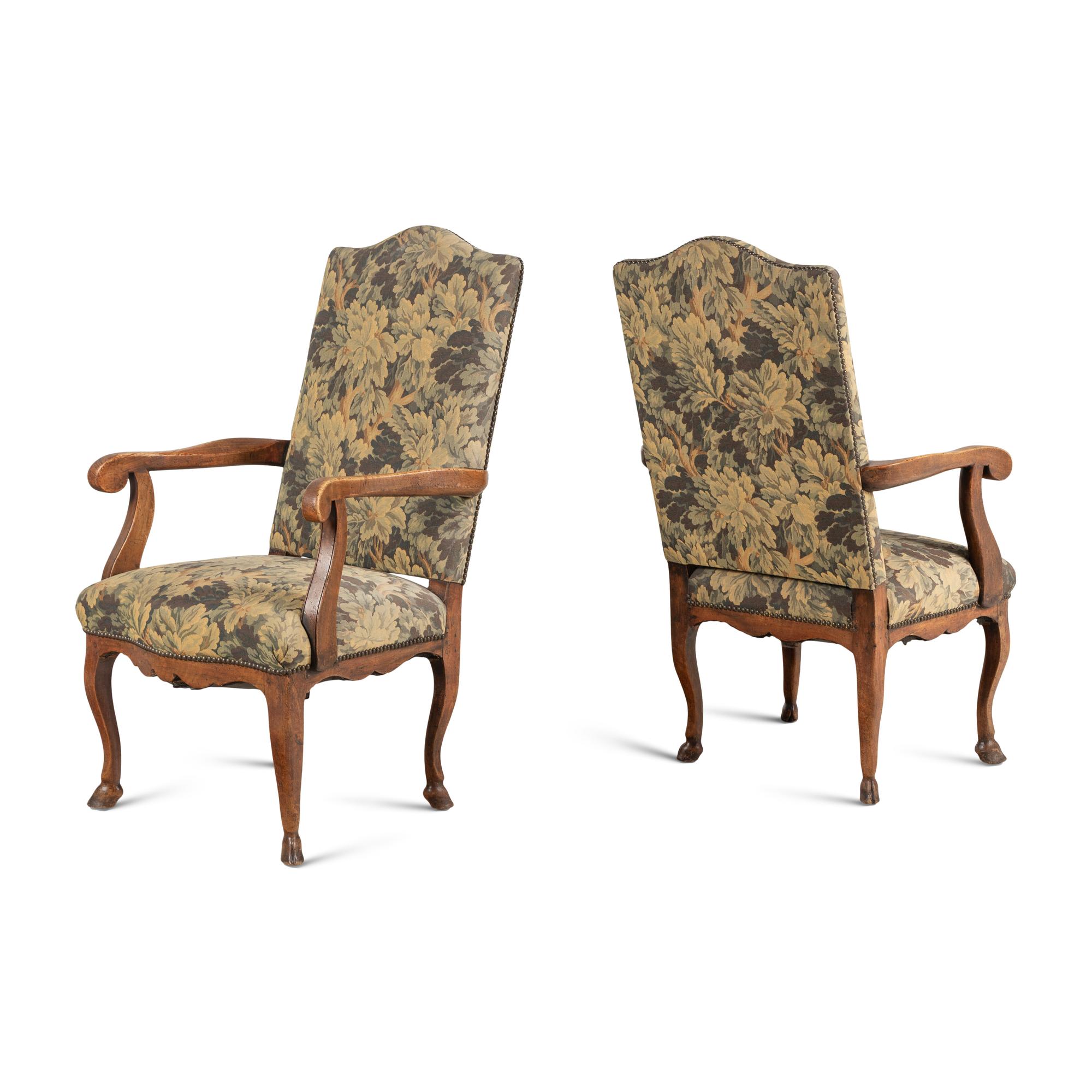 A Pair of Provincial Régence Walnut Armchairs